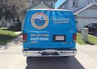 Plumber performing hydro jetting on a clogged drain in a Calgary home.